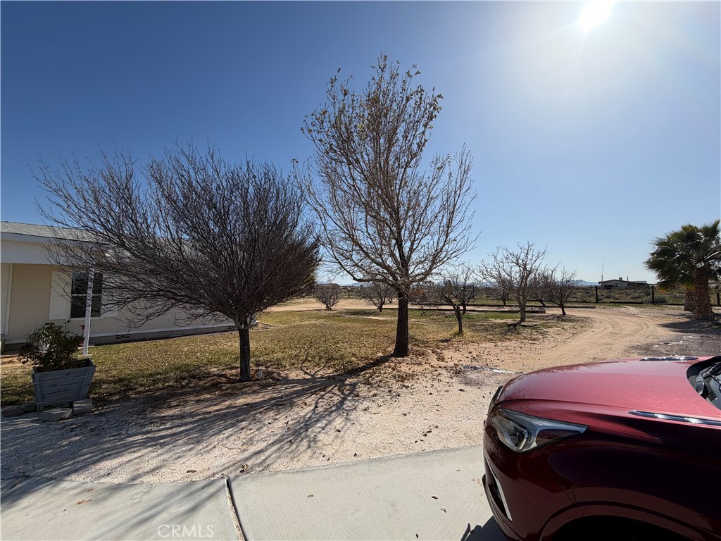 36633 Hidden River Road Hinkley, CA 92347 - Photo 8 of 19 a house view with a backyard space