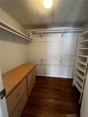 a view of storage and utility room with wooden floor