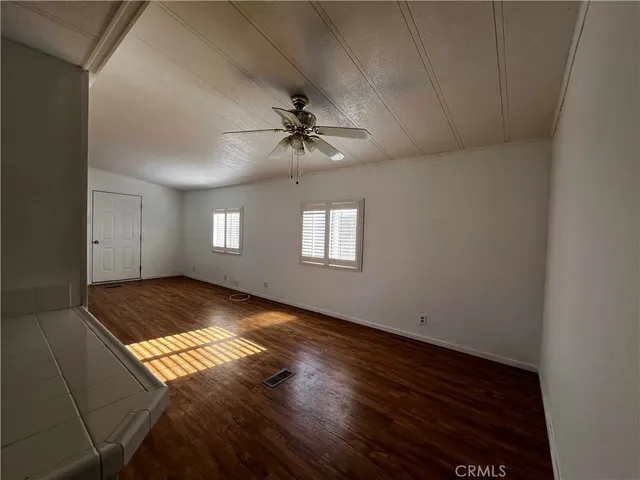 a view of an empty room and window