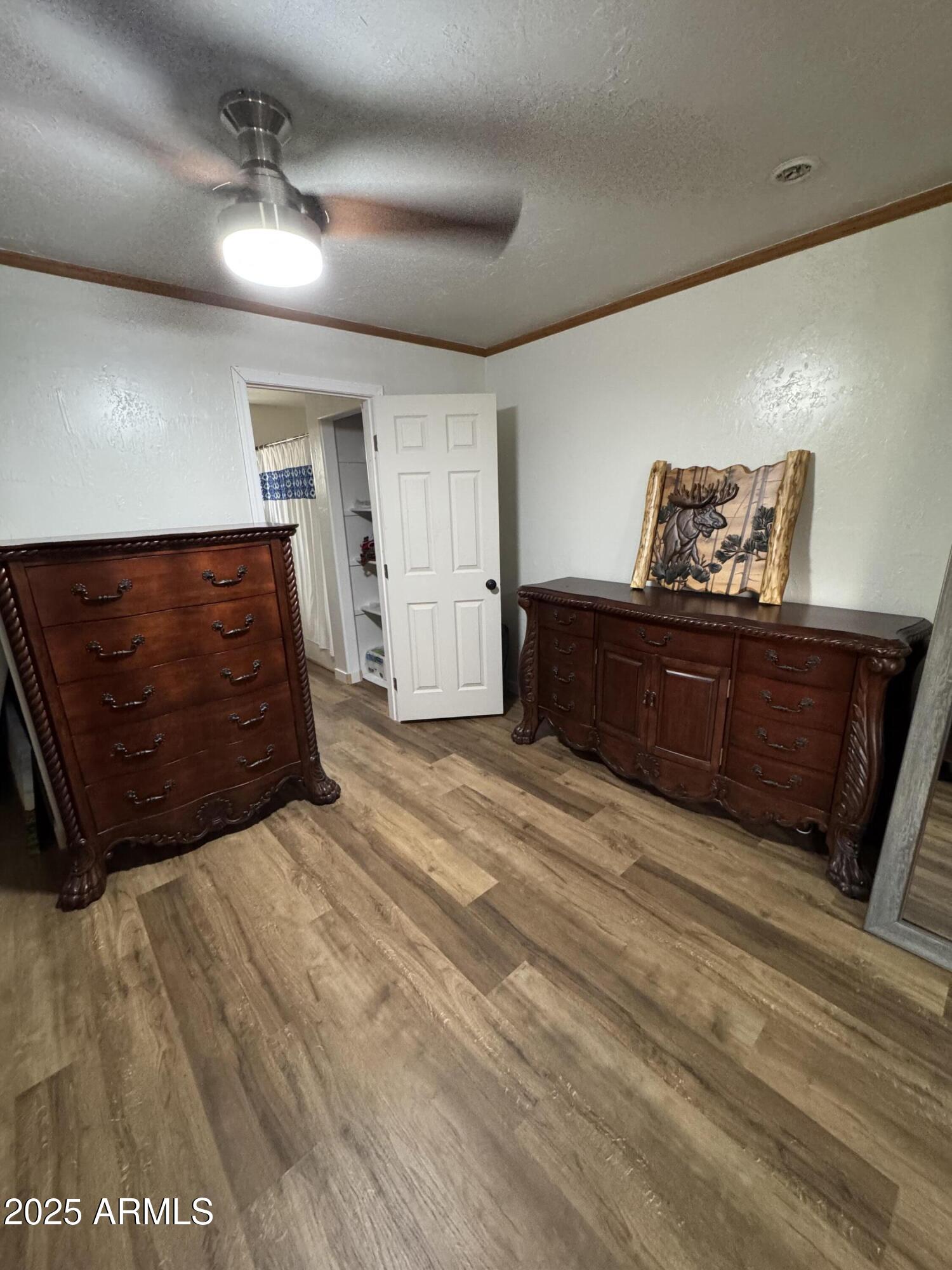 1905 Green Valley Road Heber, AZ 85928 - Photo 12 of 28 a room with a bed and cabinets