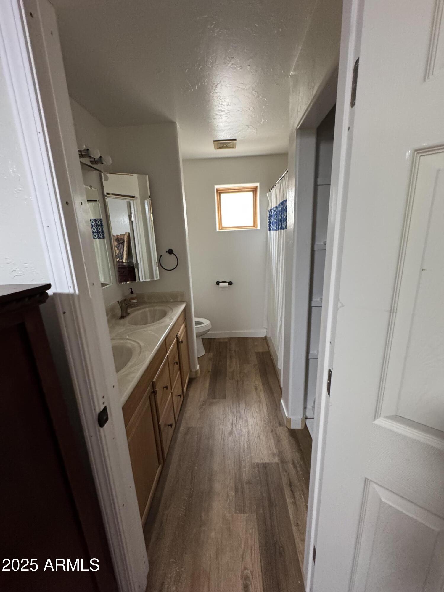 1905 Green Valley Road Heber, AZ 85928 - Photo 13 of 28 a view of a hallway with wooden floor and staircase