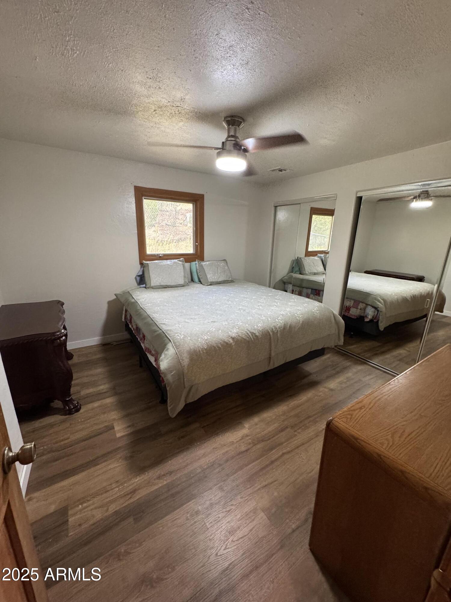 1905 Green Valley Road Heber, AZ 85928 - Photo 15 of 28 a bedroom with a bed and a couch