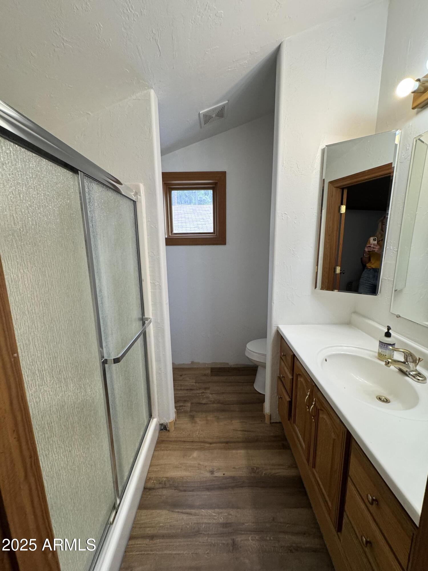 1905 Green Valley Road Heber, AZ 85928 - Photo 22 of 28 a bathroom with a double vanity sink and a mirror