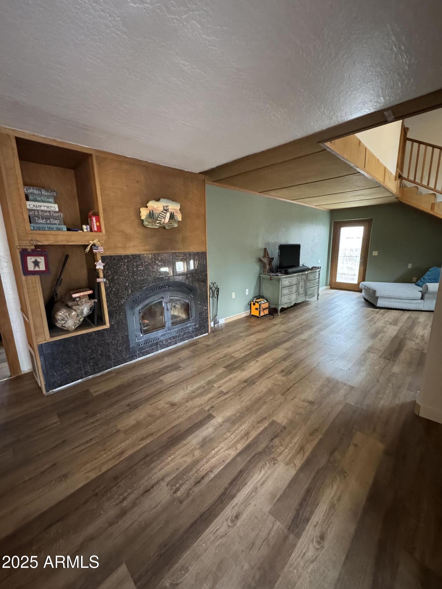 1905 Green Valley Road Heber, AZ 85928 - Photo 4 of 28 a living room with furniture and a flat screen tv