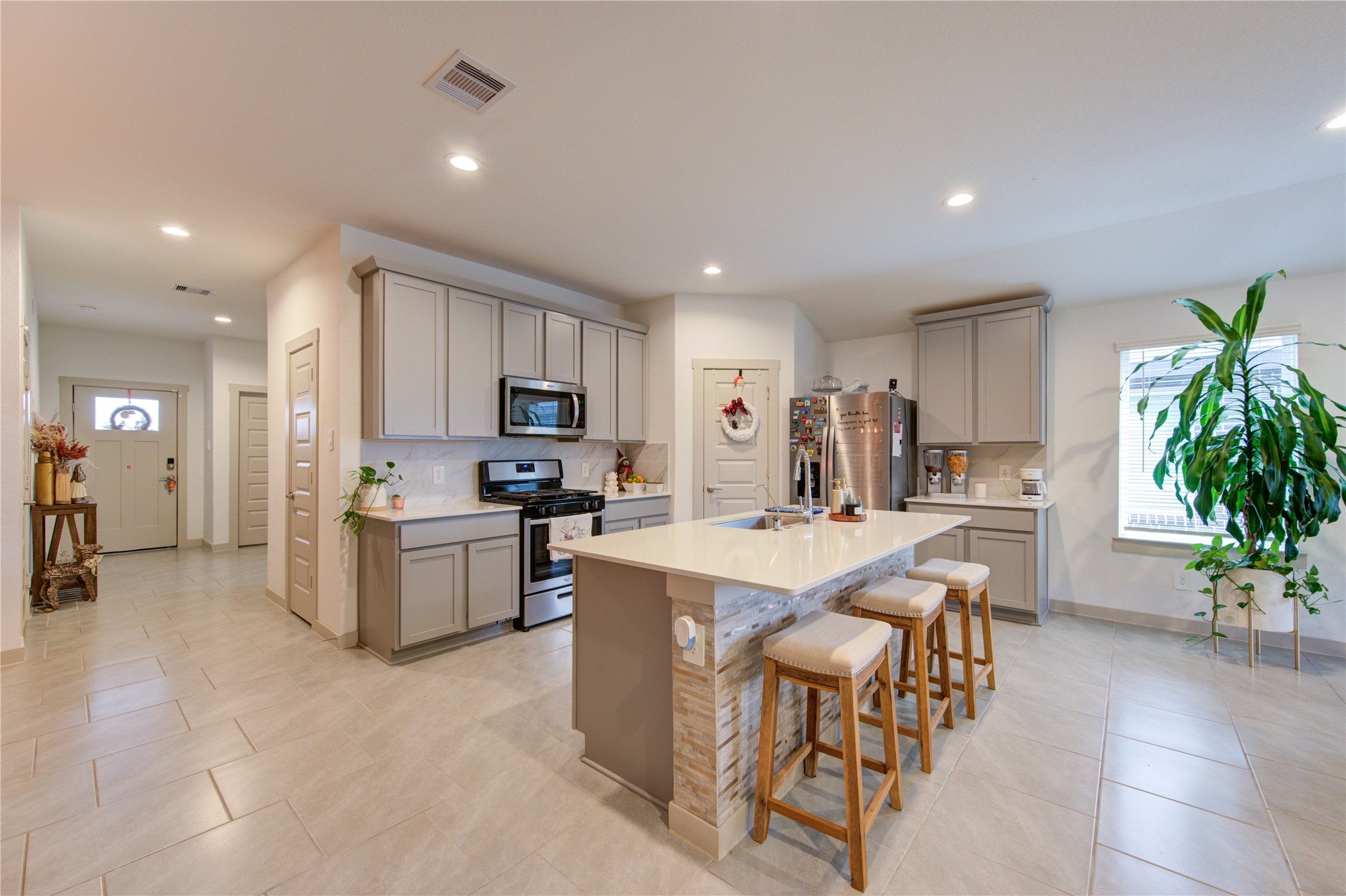 29522 Cayenne Circle Katy, TX 77494 - Photo 25 of 46 a large white kitchen with lots of counter space a sink and appliances