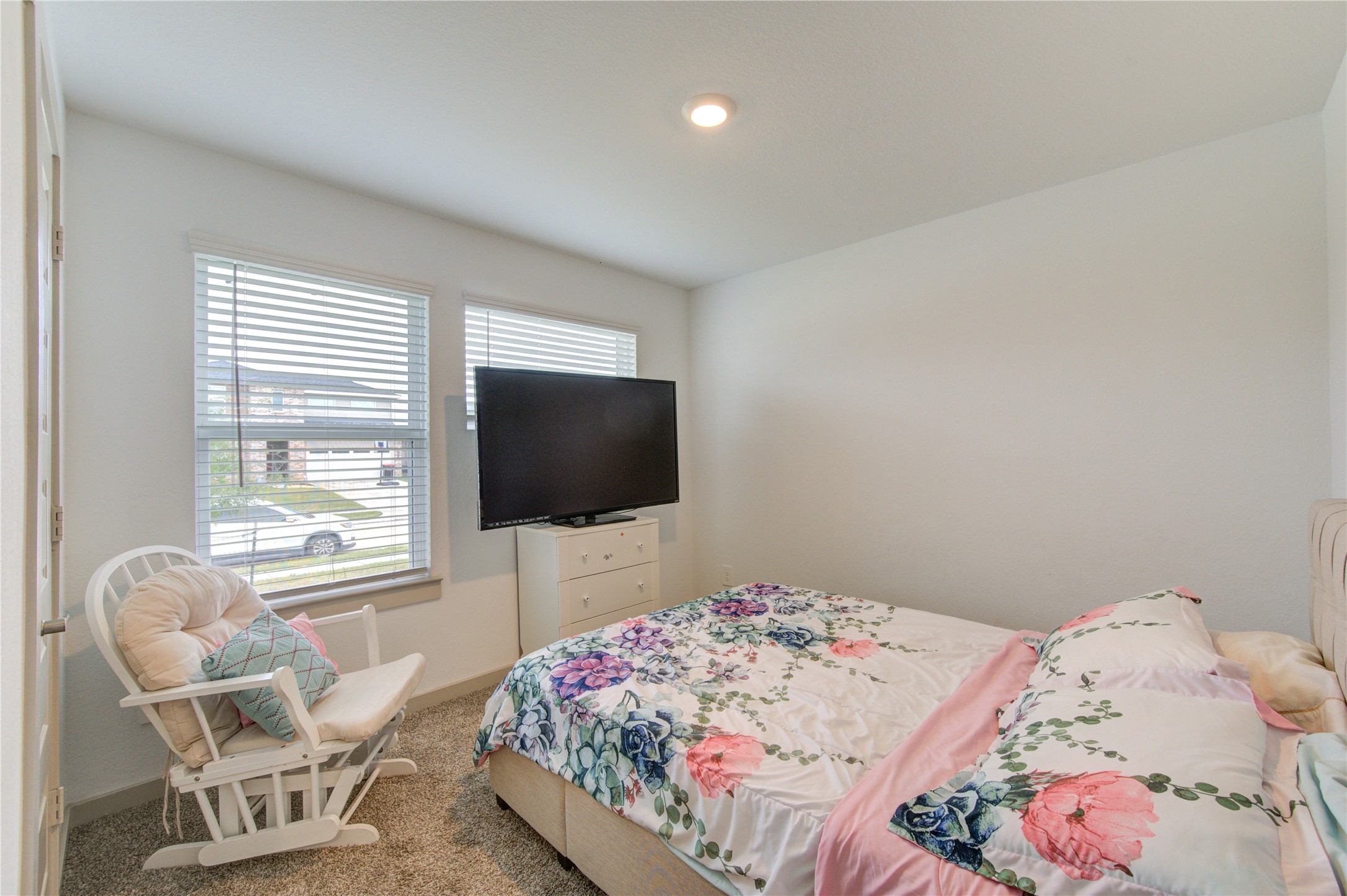 29522 Cayenne Circle Katy, TX 77494 - Photo 45 of 46 a bedroom with a bed and a flat screen tv
