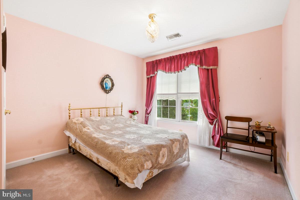 11103 Luttrell Lane Silver Spring, MD 20902 - Photo 16 of 30 Charming pastel bedroom with natural light.