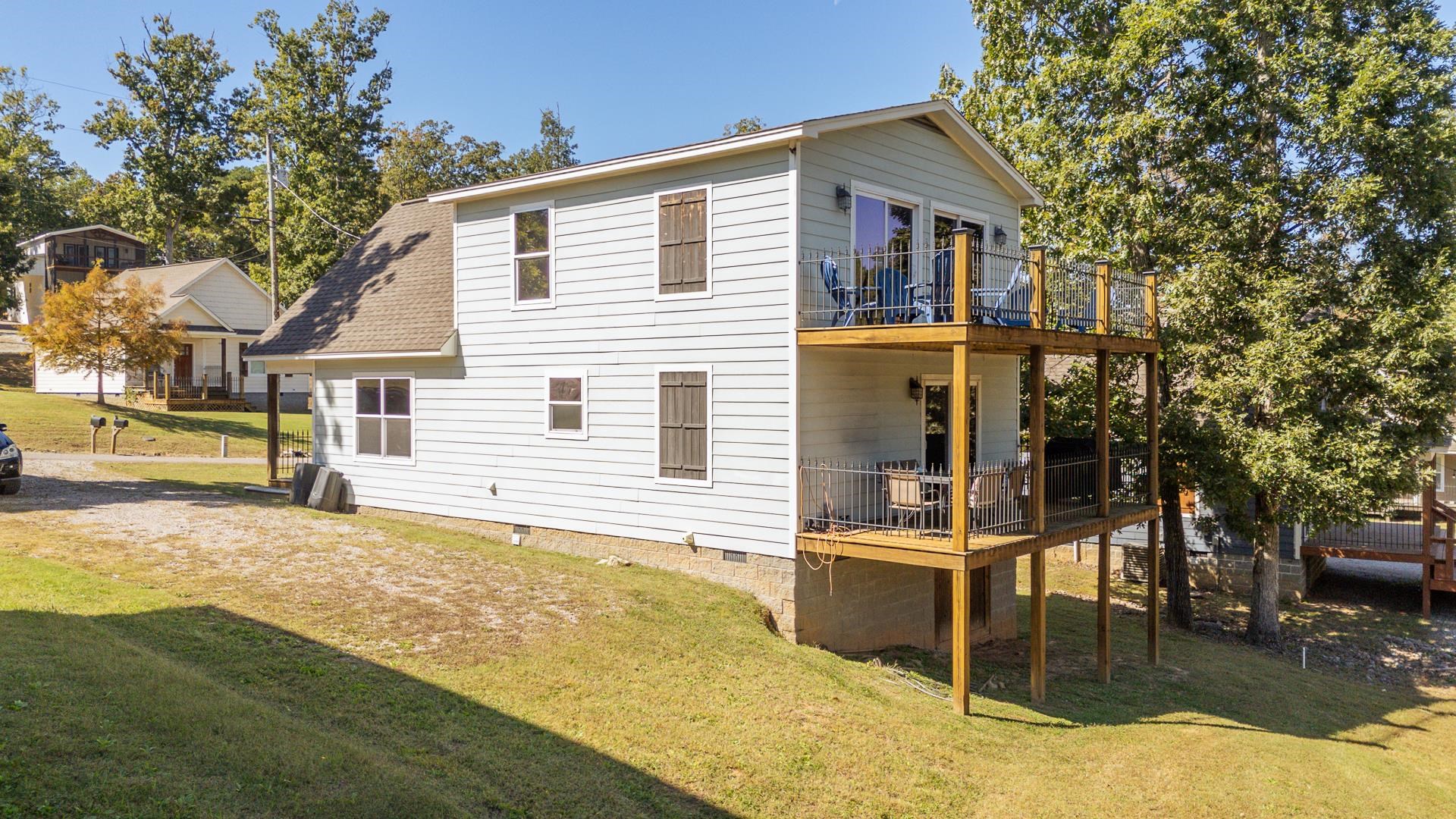 25 Bogey Loop Counce, TN 38326 - Photo 31 of 37 Rear view of property featuring a yard, crawl space, and a shingled roof