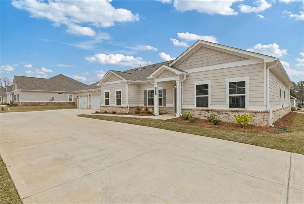 3708 Cheswolde Avenue, Unit 95 Powder Springs, GA 30127 - Photo 1 of 1 front view of a house with a yard