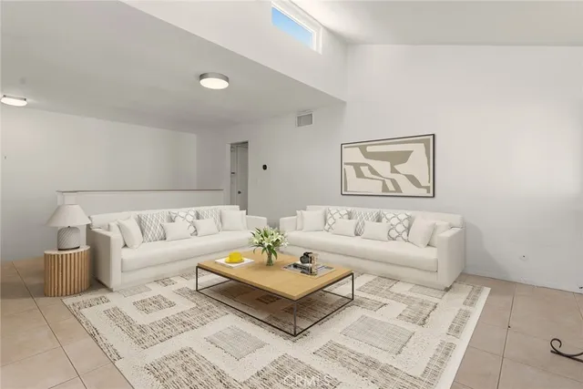 a living room with furniture and a rug