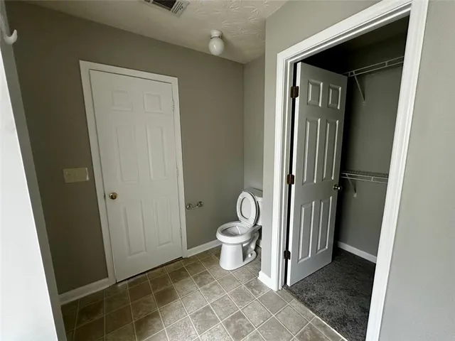 a bathroom with a toilet