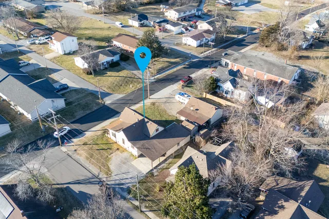 an aerial view of a house swimming pool and outdoor space