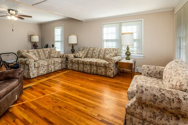 a bedroom with furniture and a window