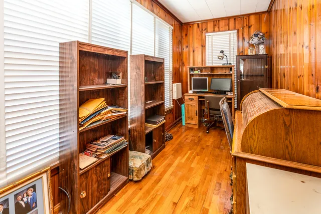 a view of a living room with furniture and a flat screen tv
