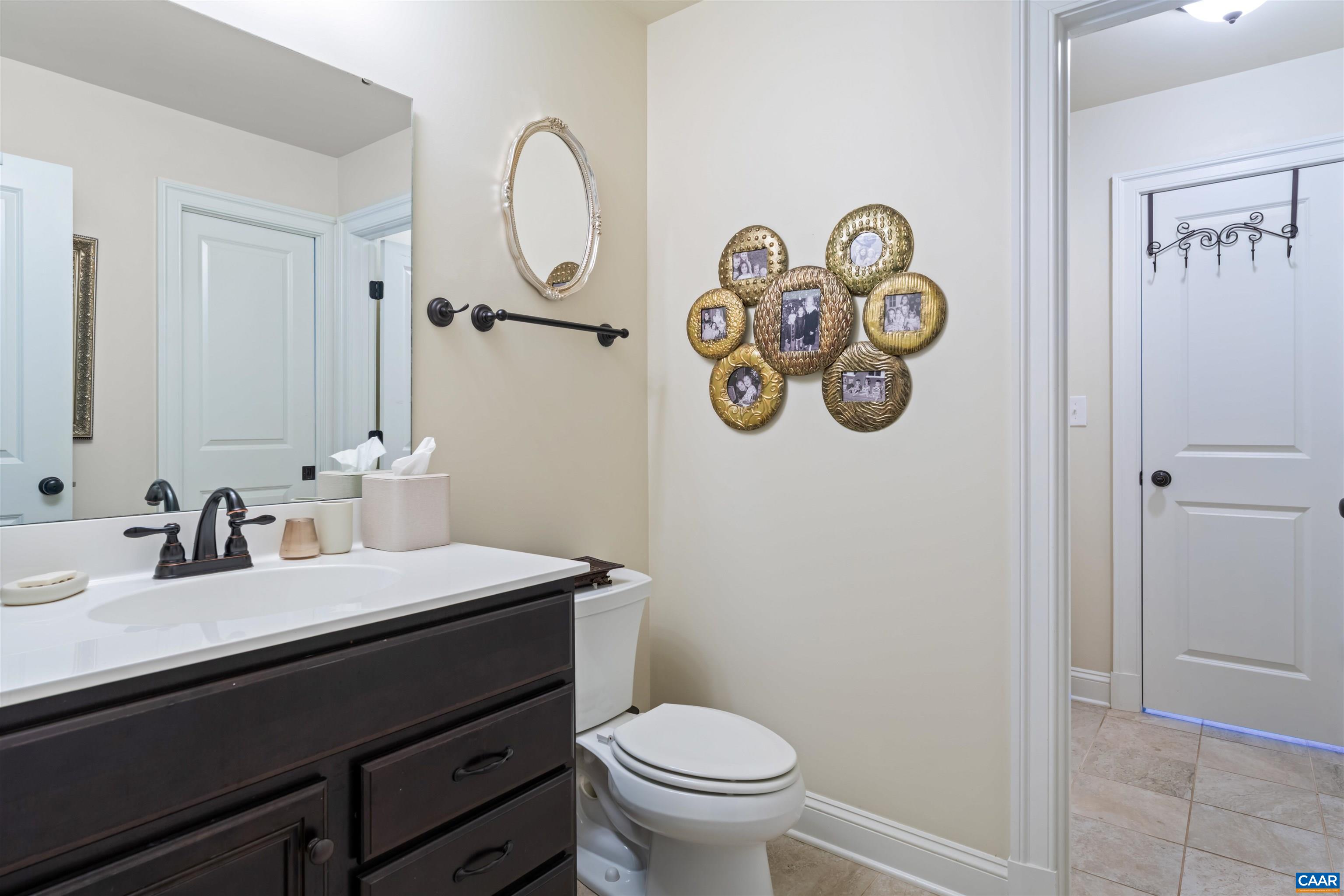 2246 Hyland Ridge Drive Charlottesville, VA 22911 - Photo 32 of 53 a bathroom with a sink and a mirror