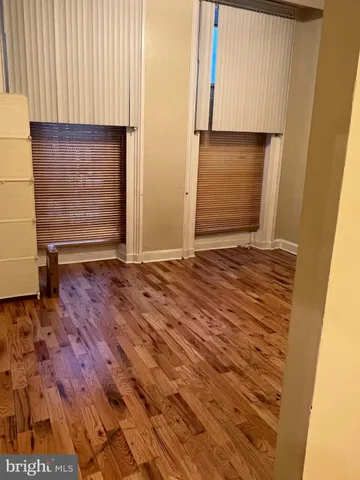 a view of room with hardwood floor