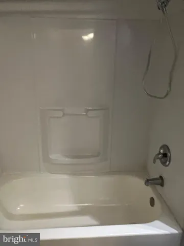 a bathroom with a toilet a sink and a shower