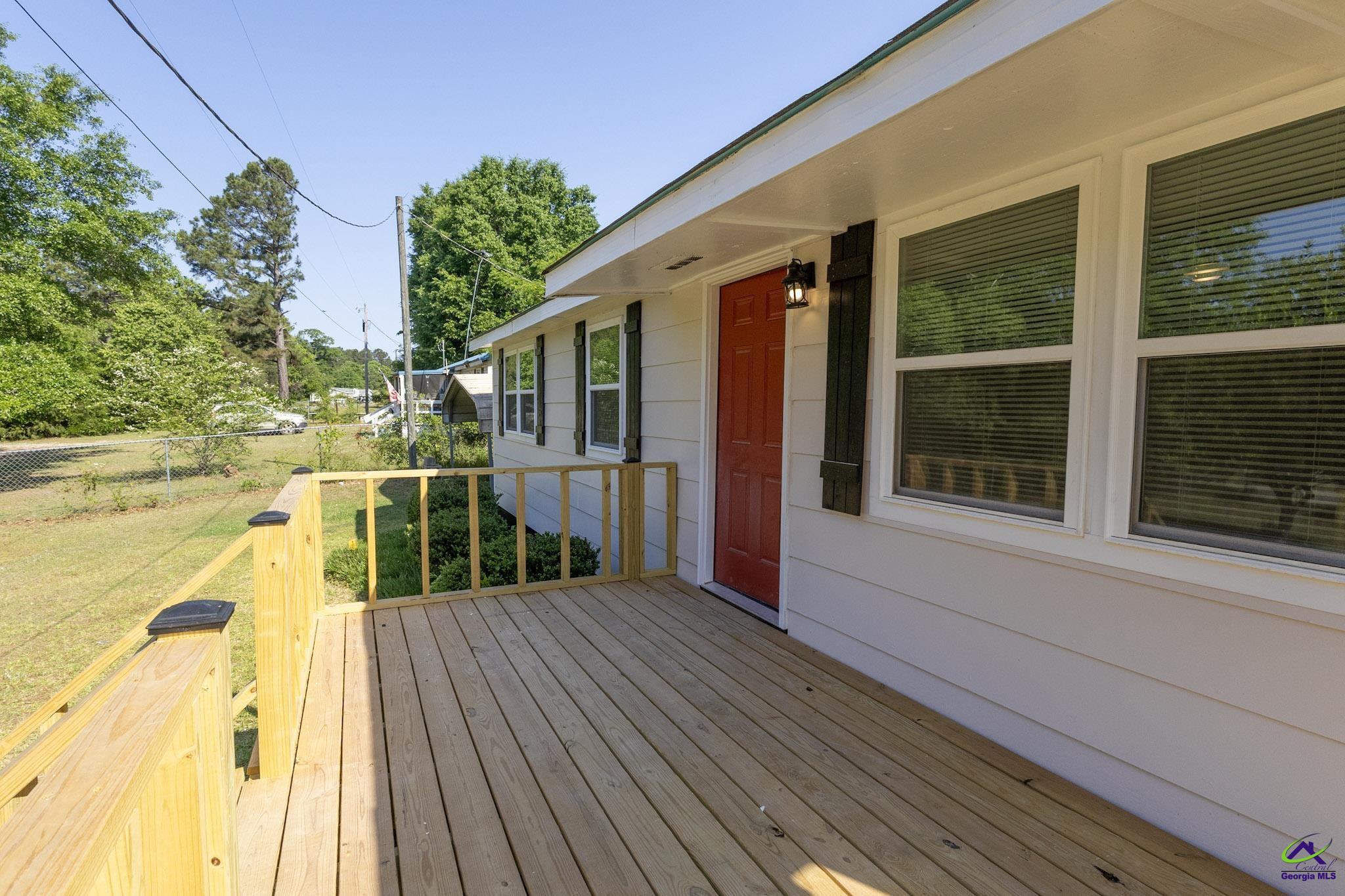 156 Churchwell Road Cochran, GA 31014 - Photo 4 of 20 a house view with a swimming pool
