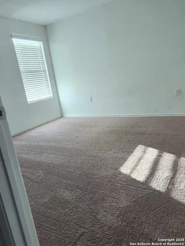 a view of room and bedroom