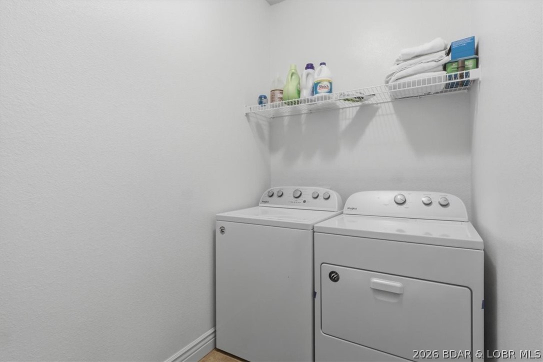 404 Country Ridge Drive Camdenton, MO 65020 - Photo 37 of 74 Laundry room with full sized washer and dryer