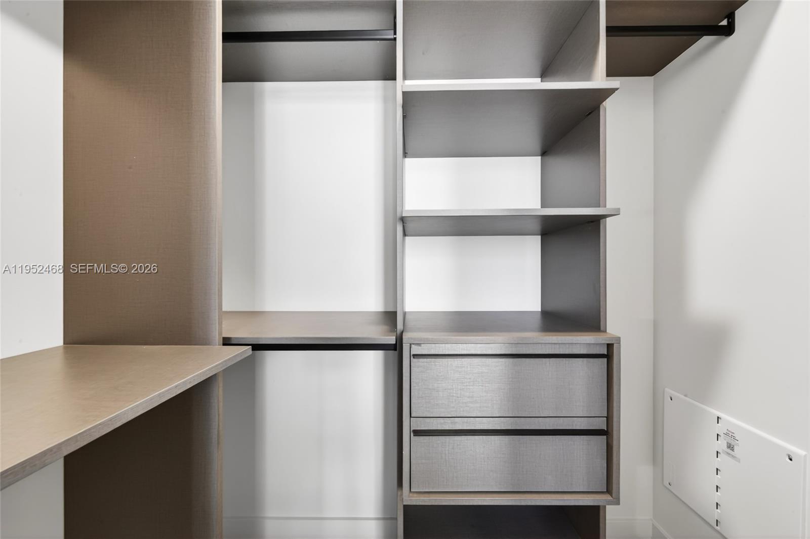 11 Northeast 6th Street, Unit 3210 Miami, FL 33132 - Photo 11 of 34 a view of walk in closet with empty racks