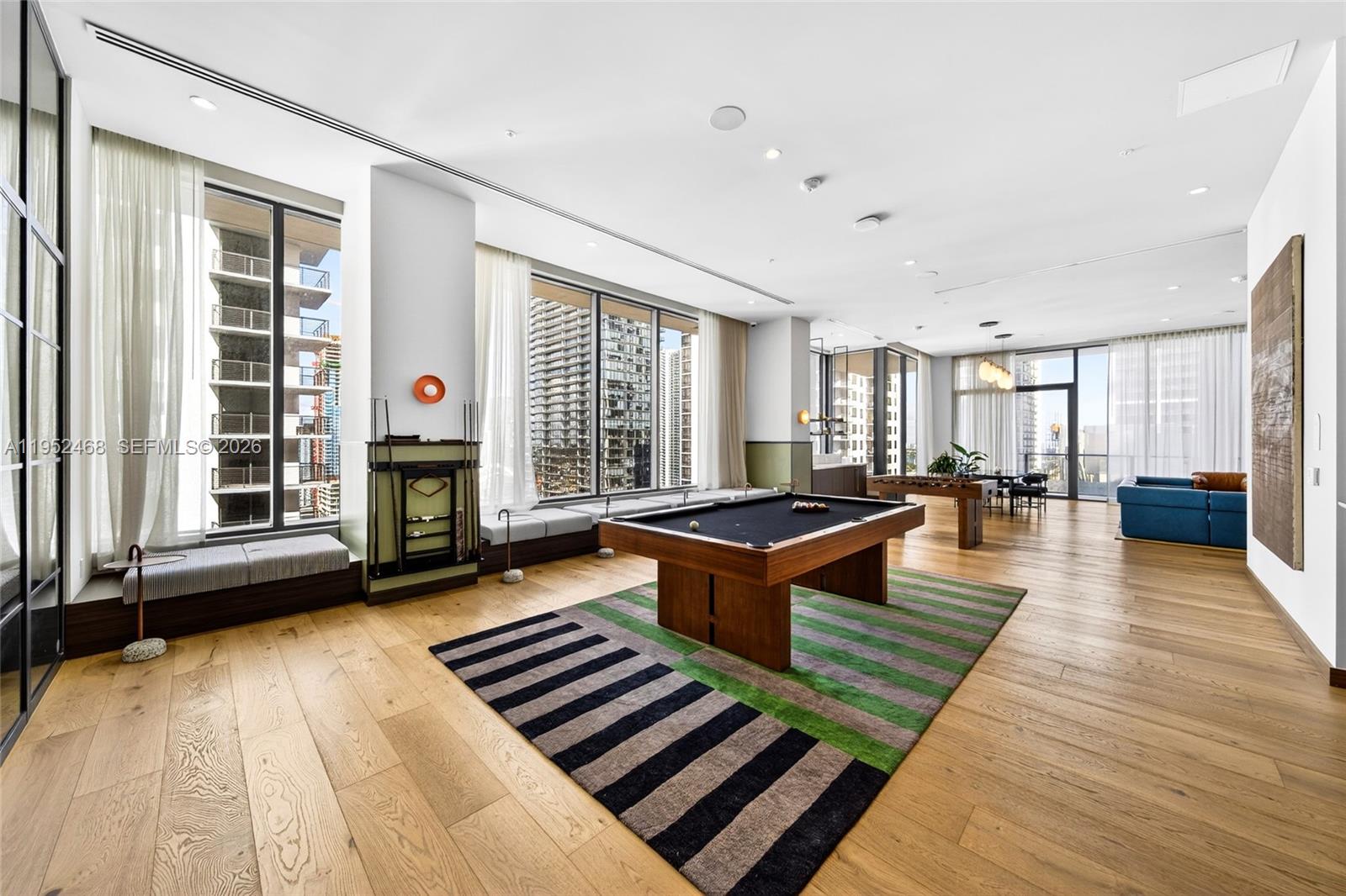 11 Northeast 6th Street, Unit 3210 Miami, FL 33132 - Photo 23 of 34 a living room with furniture and a fireplace