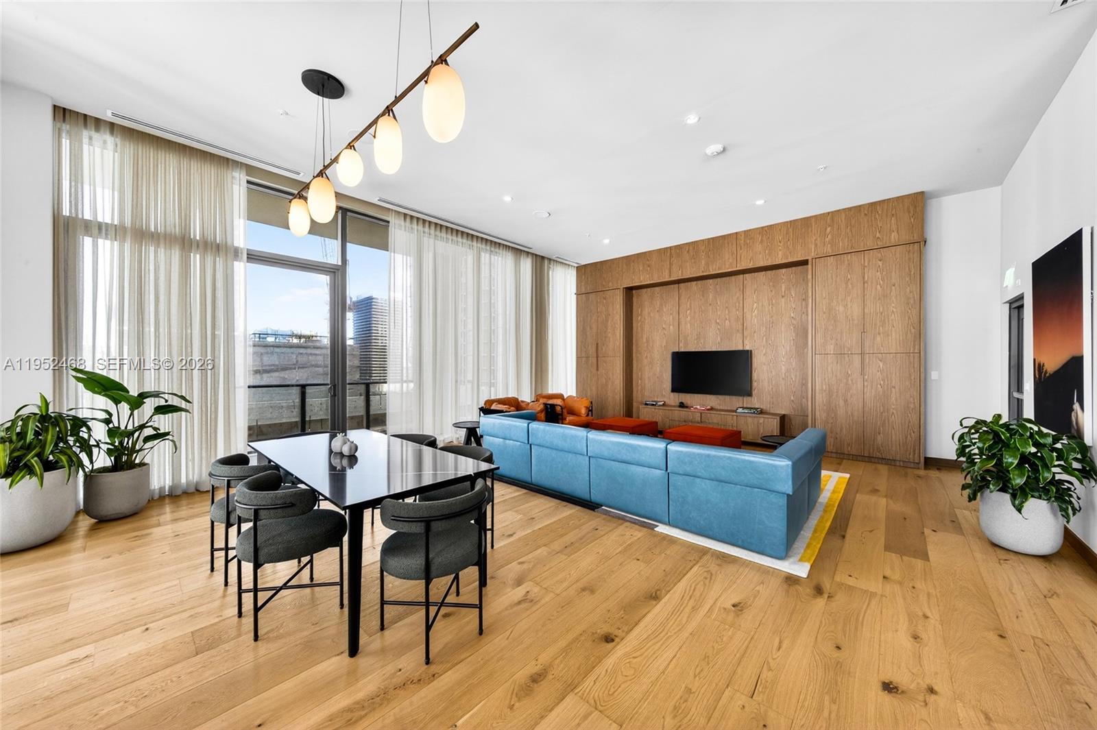 11 Northeast 6th Street, Unit 3210 Miami, FL 33132 - Photo 24 of 34 a living room with furniture and a large window