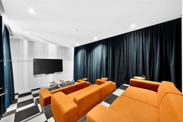 a bed room with a bed and a television