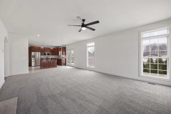 a kitchen with a sink a counter top space and stainless steel appliances