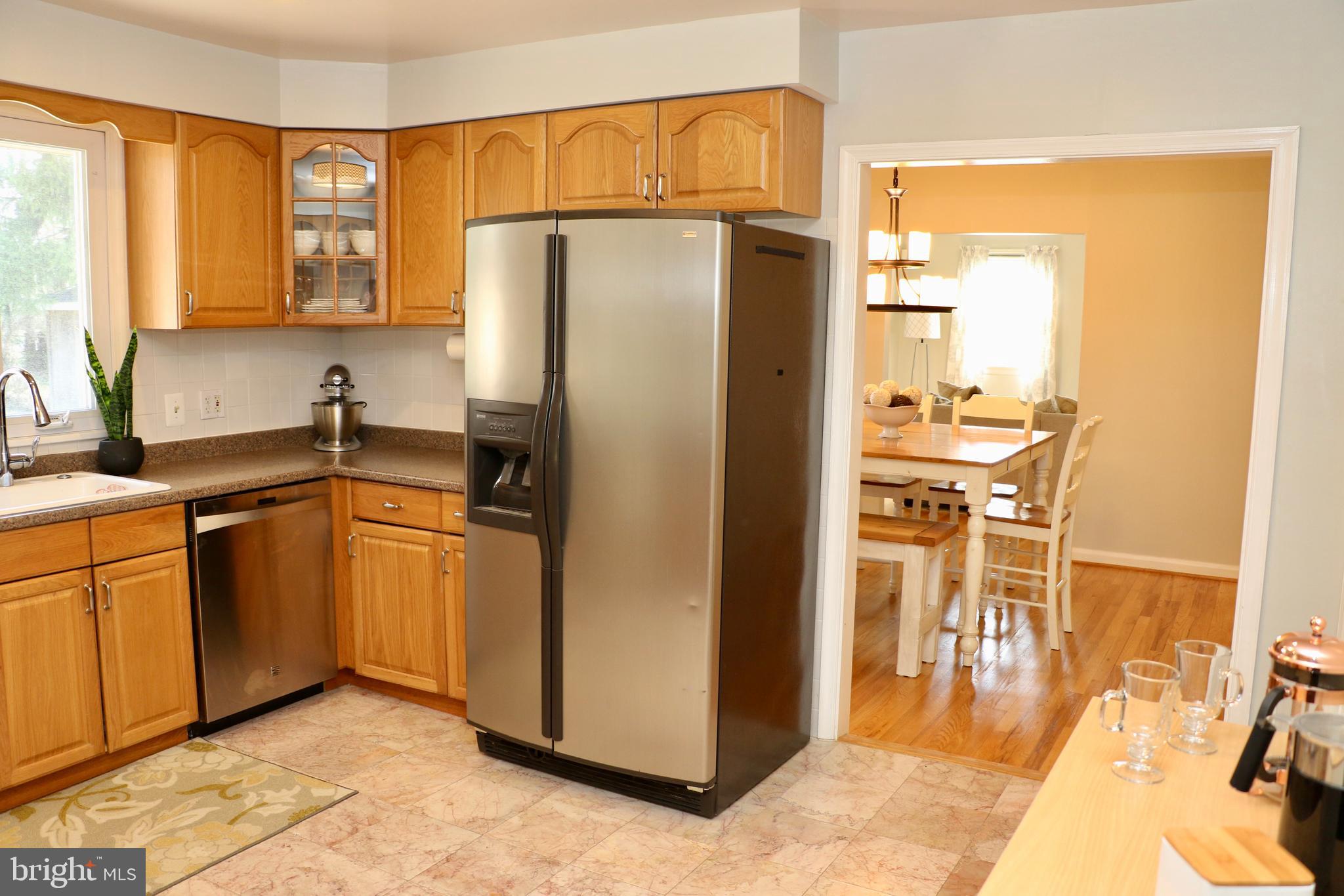 2307 Silverside Road Wilmington, DE 19810 - Photo 4 of 40 a kitchen with stainless steel appliances granite countertop a refrigerator and a sink