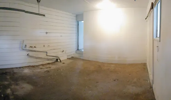 an empty room with fan
