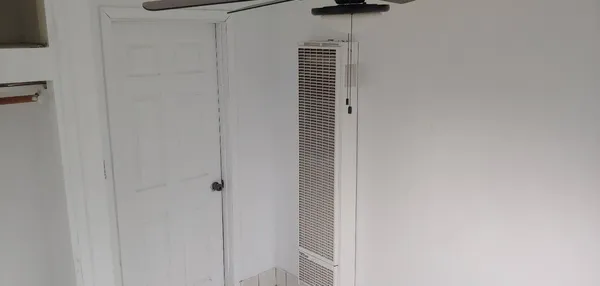 a view of hallway with shower