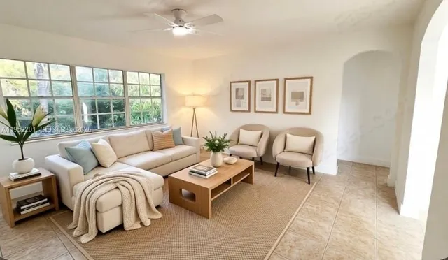 a living room with furniture and a large window