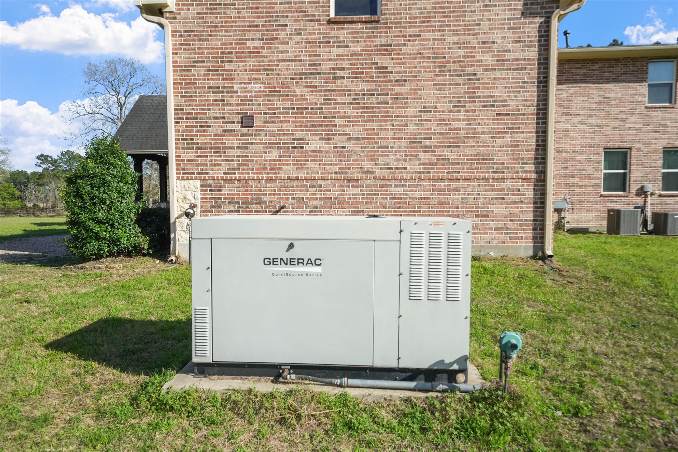 26250 A Riley Road Waller, TX 77484 - Photo 31 of 50 45 kW Generac backup generator with 1,000-gallon leased propane tank for reliable power to critical systems.