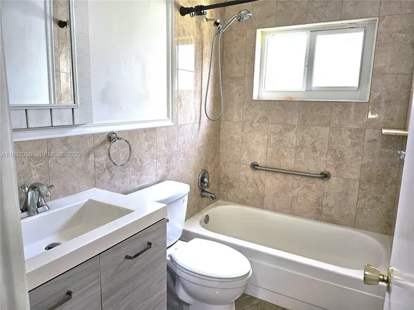 a kitchen with stainless steel appliances granite countertop a stove a sink dishwasher a refrigerator and cabinets with wooden floor