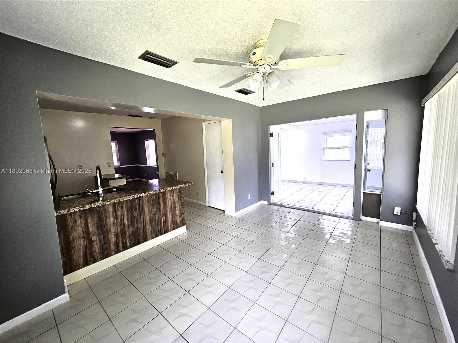 1040 Northwest 73rd Terrace Margate, FL 33063 - Photo 26 of 41 a view of a bathroom with a sink and a mirror