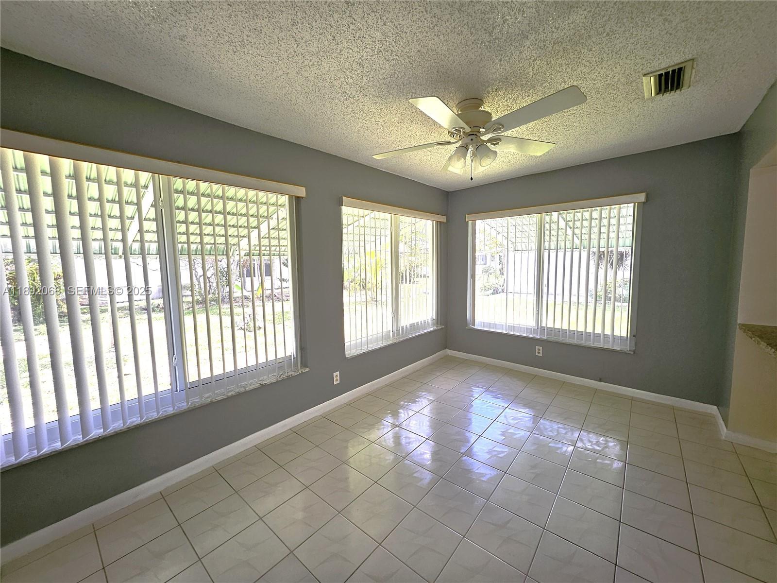 1040 Northwest 73rd Terrace Margate, FL 33063 - Photo 27 of 41 a view of an empty room with a window