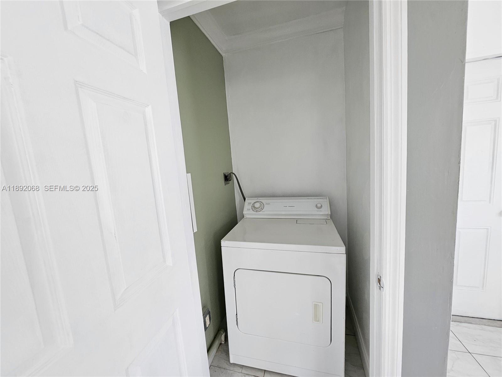 1040 Northwest 73rd Terrace Margate, FL 33063 - Photo 30 of 41 a utility room with dryer and washer