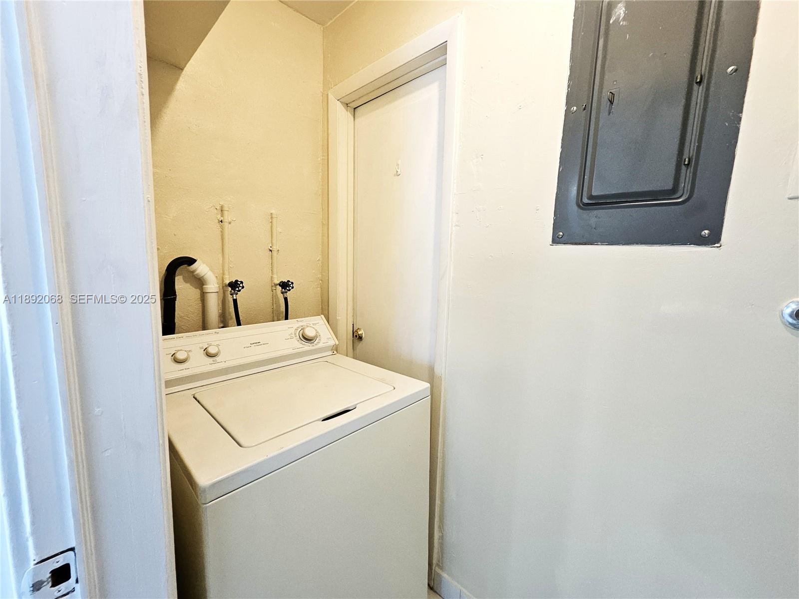 1040 Northwest 73rd Terrace Margate, FL 33063 - Photo 31 of 41 a utility room with dryer and washer