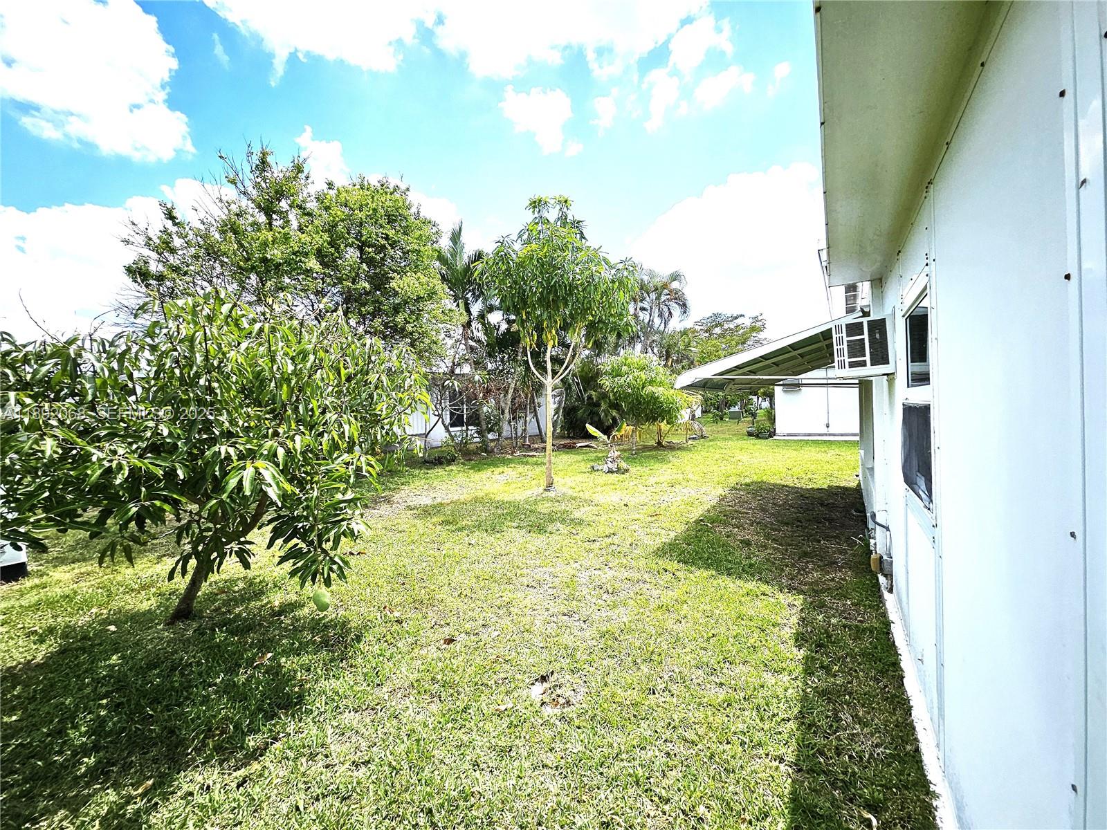 1040 Northwest 73rd Terrace Margate, FL 33063 - Photo 37 of 41 a view of a yard with an outdoor space