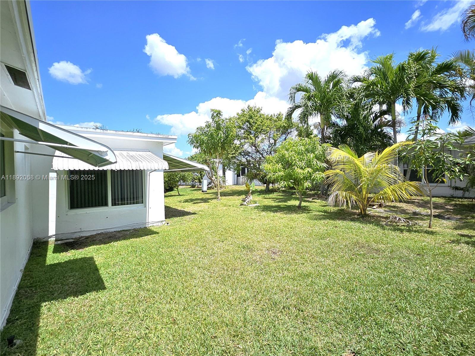 1040 Northwest 73rd Terrace Margate, FL 33063 - Photo 9 of 41 a view of backyard with swimming pool