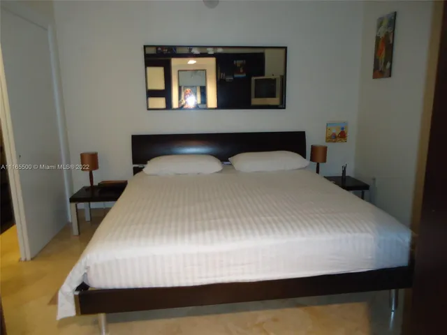 a view of a living room with a flat screen tv