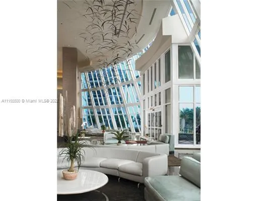 a view of swimming pool with outdoor seating and plants