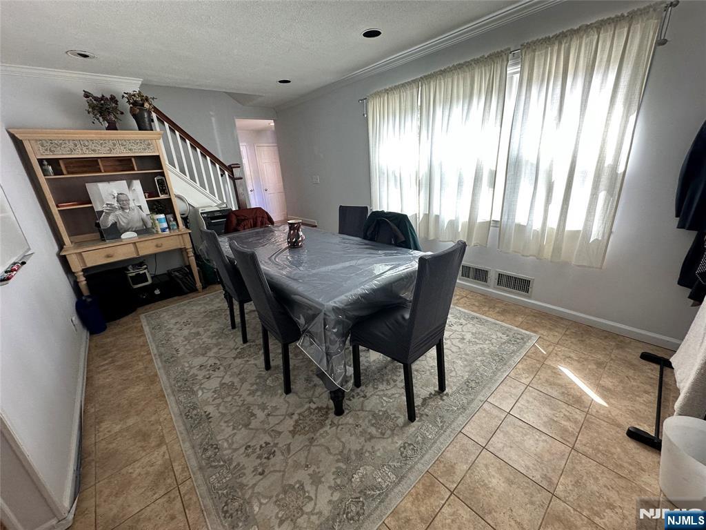 410 Burlington Road Paramus, NJ 07652 - Photo 7 of 12 a dining room with furniture and window