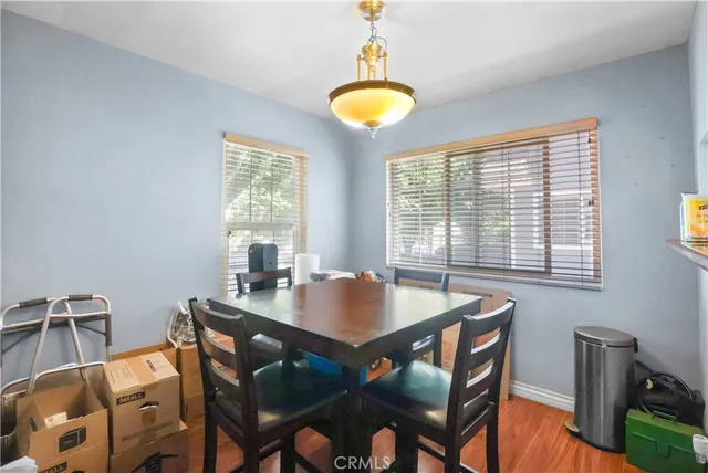 a view of a dining room with furniture and window