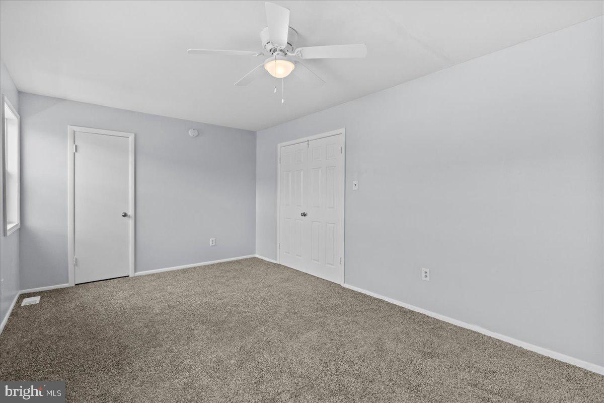 10 Longbow Court Sicklerville, NJ 08081 - Photo 18 of 26 a view of an empty room with a ceiling fan
