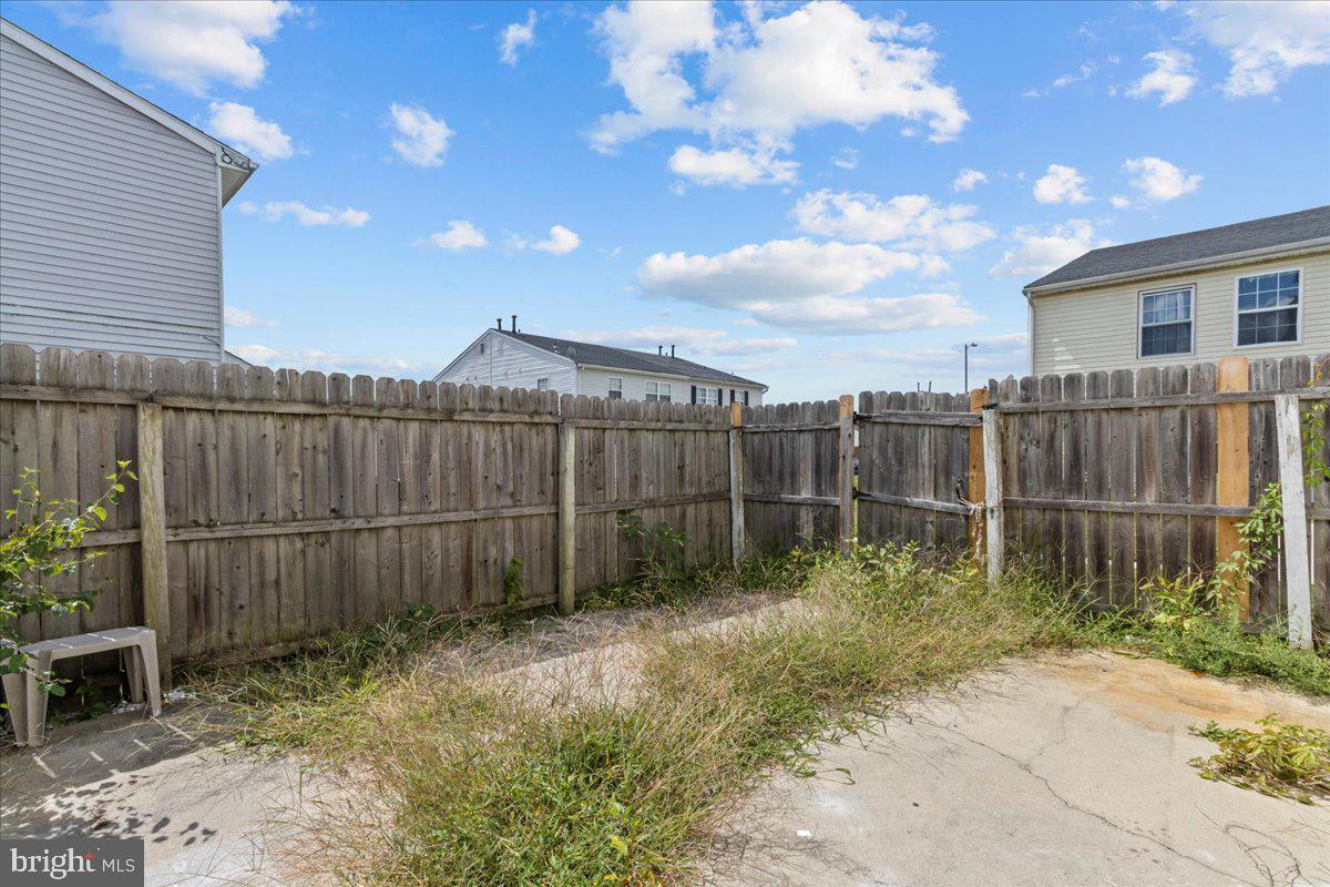 10 Longbow Court Sicklerville, NJ 08081 - Photo 25 of 26 a backyard of a house with wooden fence