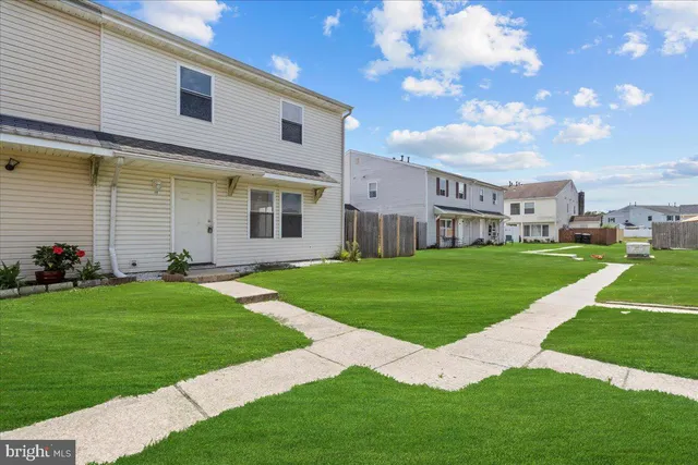 a view of a house with a big yard