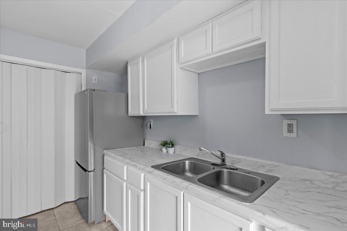 10 Longbow Court Sicklerville, NJ 08081 - Photo 9 of 26 a kitchen with stainless steel appliances granite countertop a refrigerator sink and cabinets