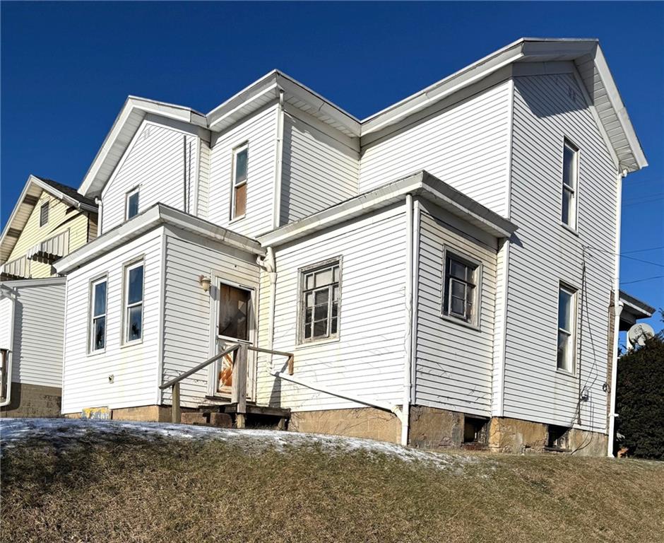 438 New York Avenue Rochester, PA 15074 - Photo 2 of 4 a view of a white house with a large windows